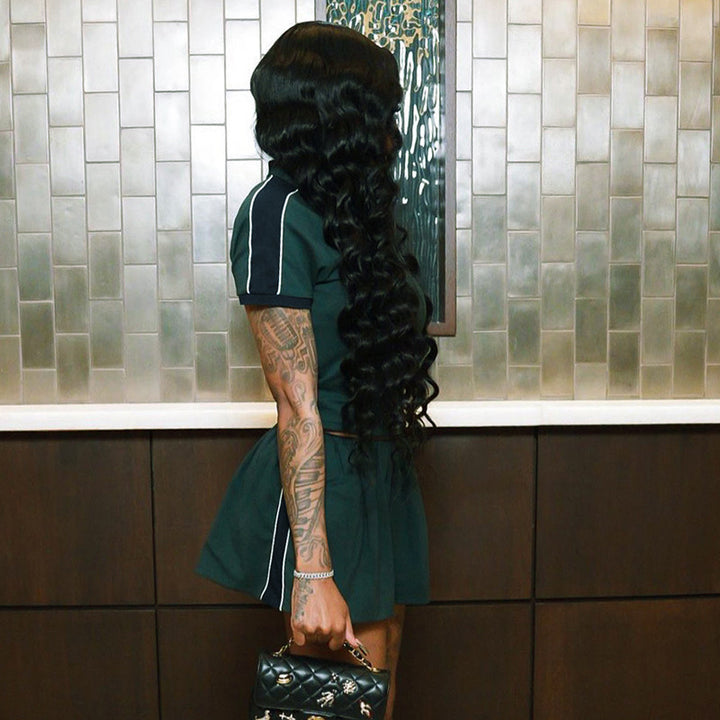 Damern Sportigt Tvådelat Outfit med Poloshirt och Korta Byxor Mirla-Eva Jonsson