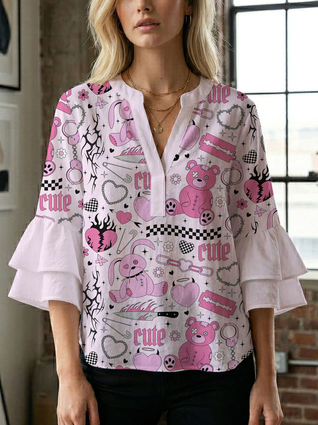 Damern blusenshirt med voluminösa ärmar och kreativt tryckdesign Mirla-Eva Jonsson