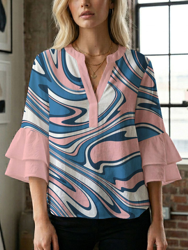 Damern blusenshirt med voluminösa ärmar och kreativt tryckdesign Mirla-Eva Jonsson