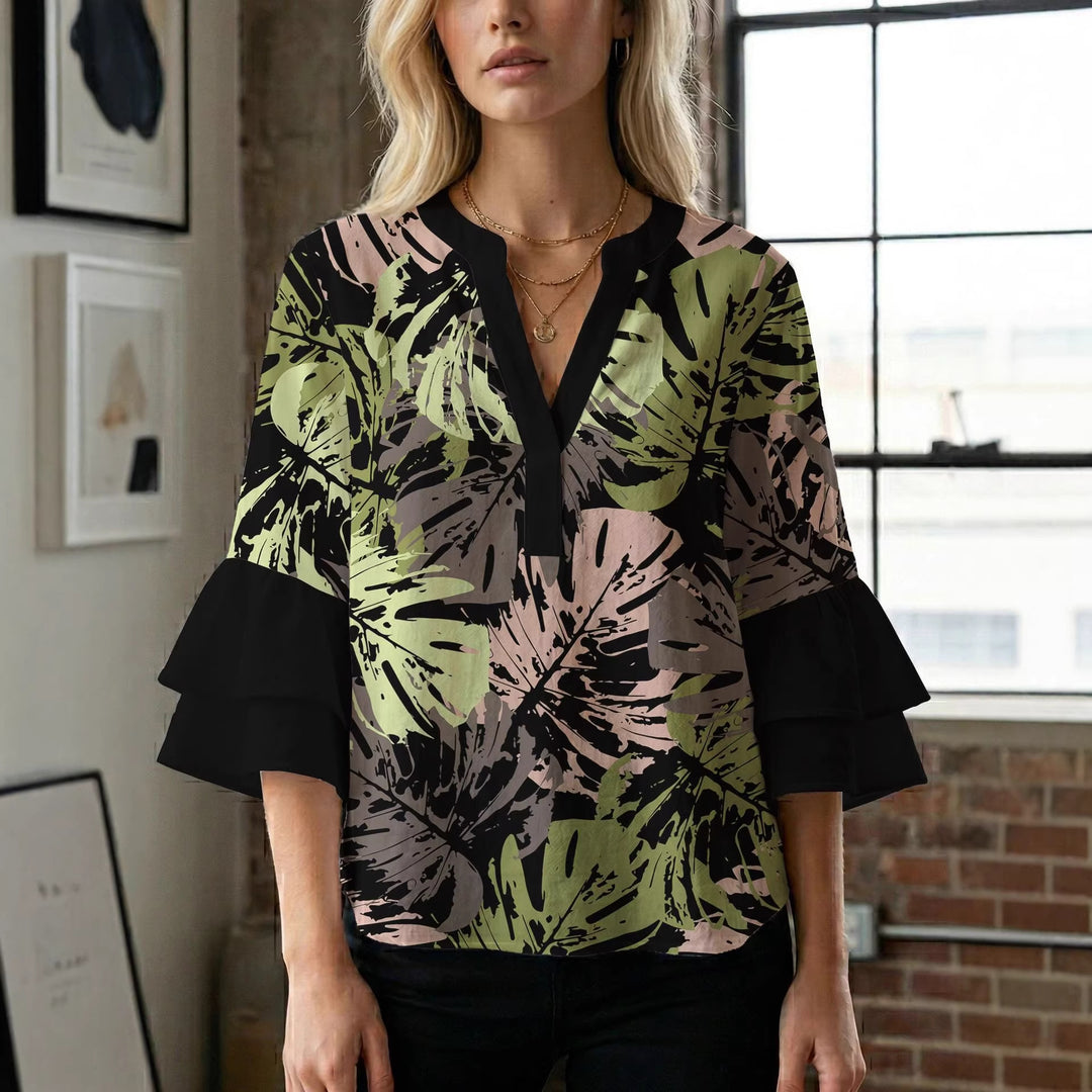 Damern blusenshirt med voluminösa ärmar och kreativt tryckdesign Mirla-Eva Jonsson