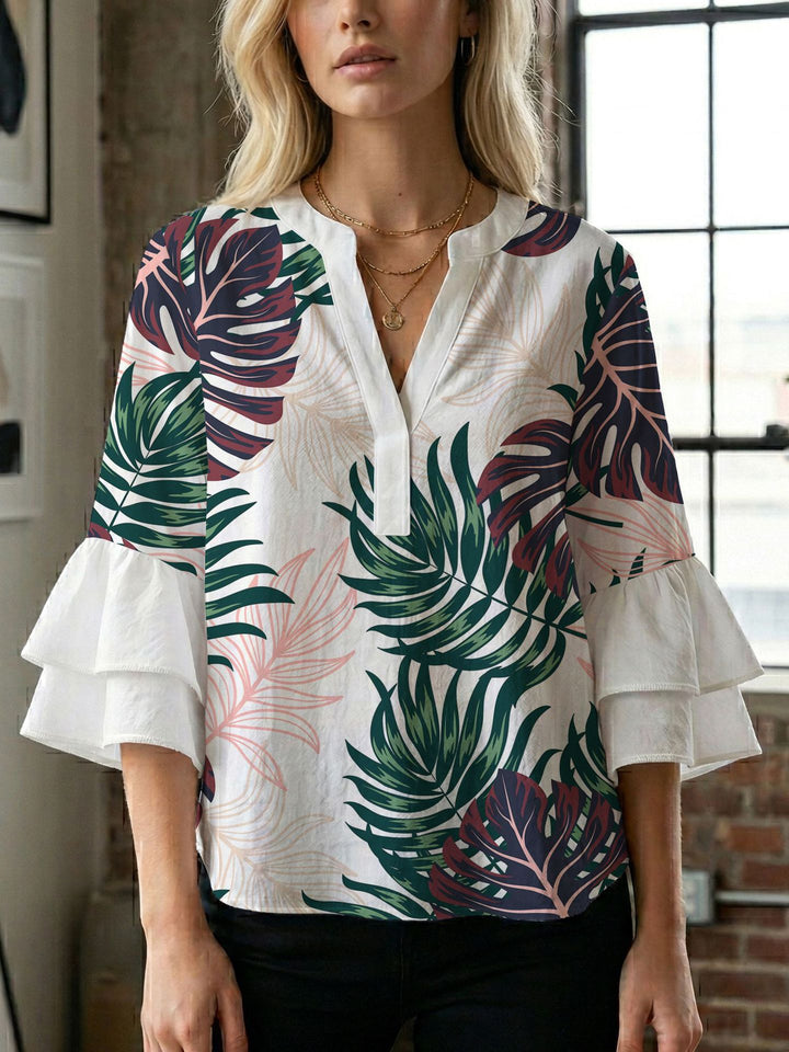 Damern blusenshirt med voluminösa ärmar och kreativt tryckdesign Mirla-Eva Jonsson