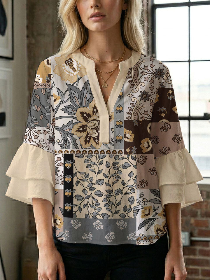 Damern blusenshirt med voluminösa ärmar och kreativt tryckdesign Mirla-Eva Jonsson