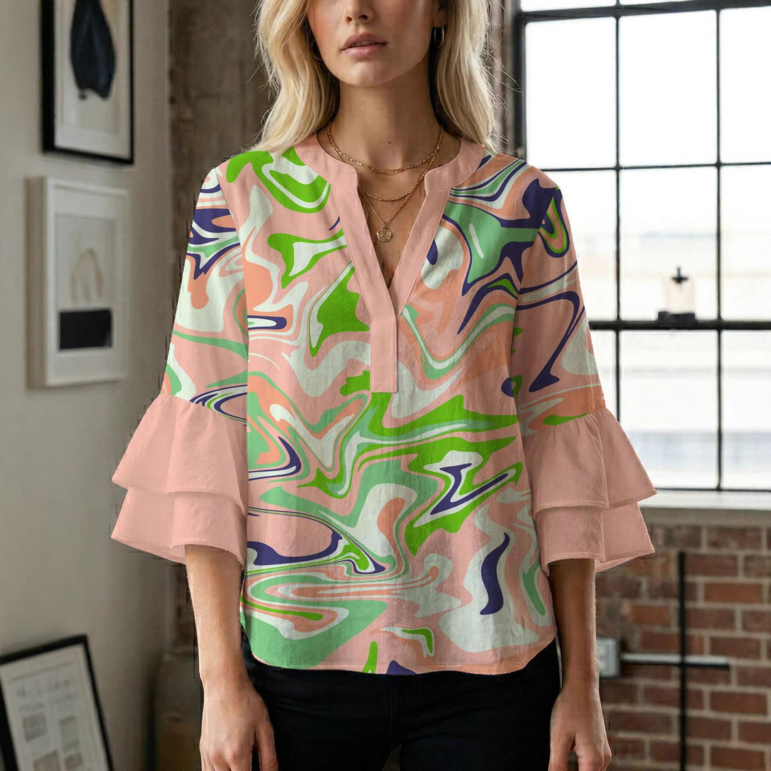 Damern blusenshirt med voluminösa ärmar och kreativt tryckdesign Mirla-Eva Jonsson