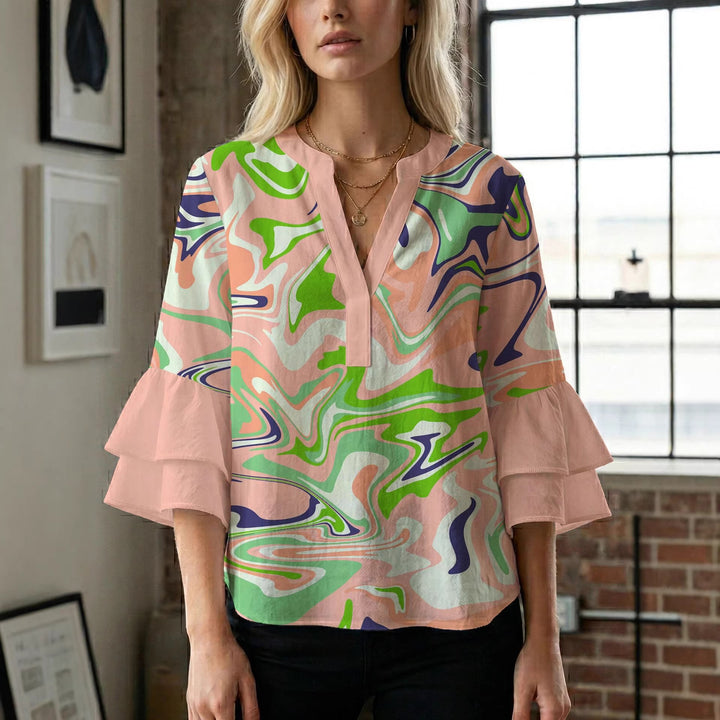 Damern blusenshirt med voluminösa ärmar och kreativt tryckdesign Mirla-Eva Jonsson