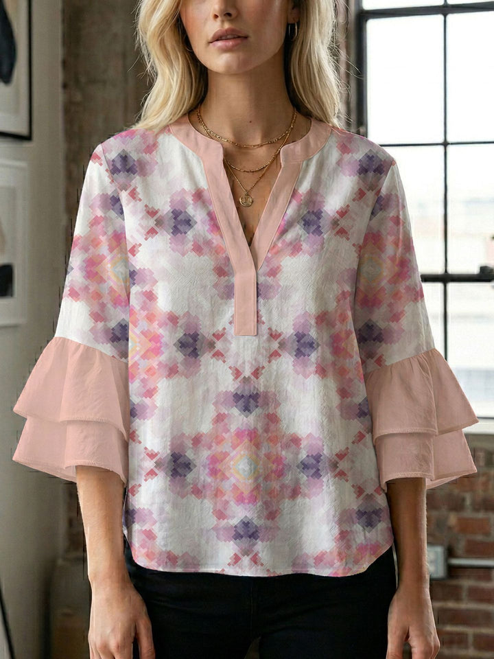 Damern blusenshirt med voluminösa ärmar och kreativt tryckdesign Mirla-Eva Jonsson