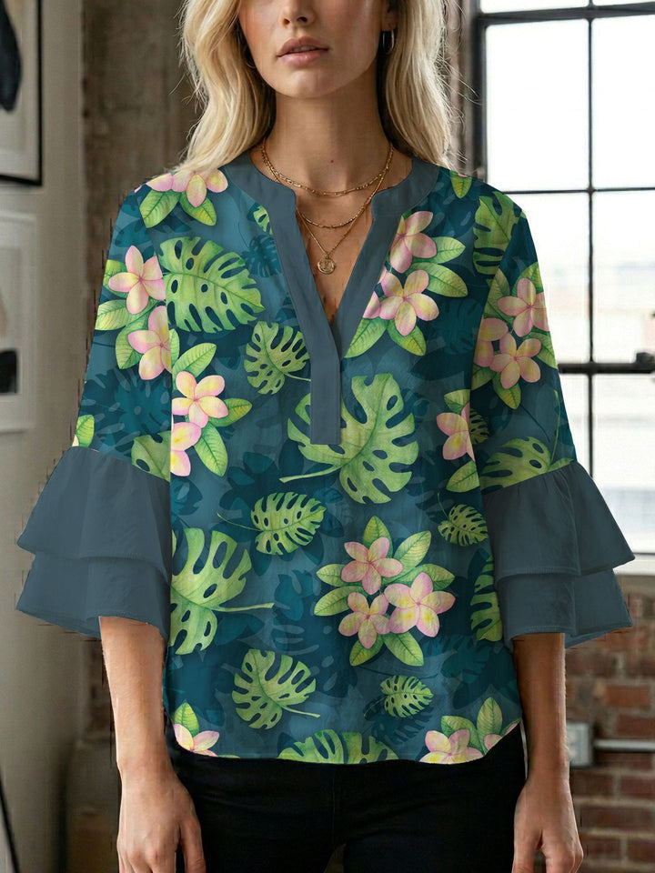 Damern blusenshirt med voluminösa ärmar och kreativt tryckdesign Mirla-Eva Jonsson