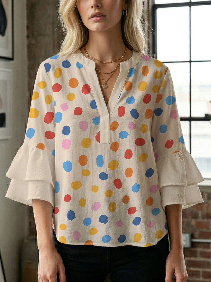 Damern blusenshirt med voluminösa ärmar och kreativt tryckdesign Mirla-Eva Jonsson