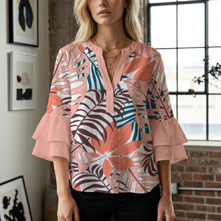 Damern blusenshirt med voluminösa ärmar och kreativt tryckdesign Mirla-Eva Jonsson
