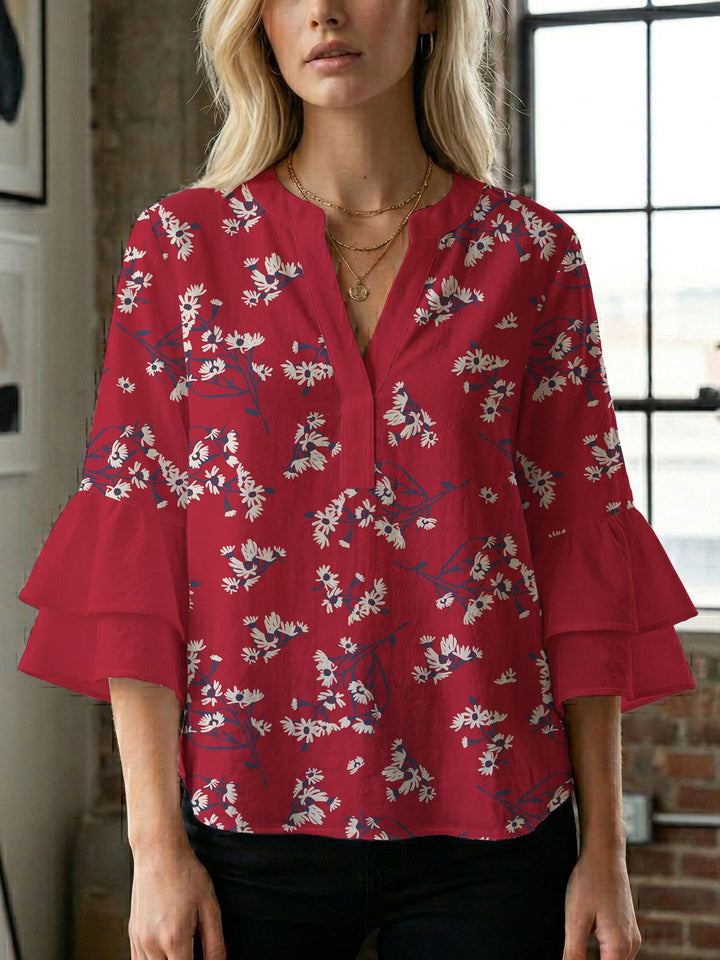 Damern blusenshirt med voluminösa ärmar och kreativt tryckdesign Mirla-Eva Jonsson