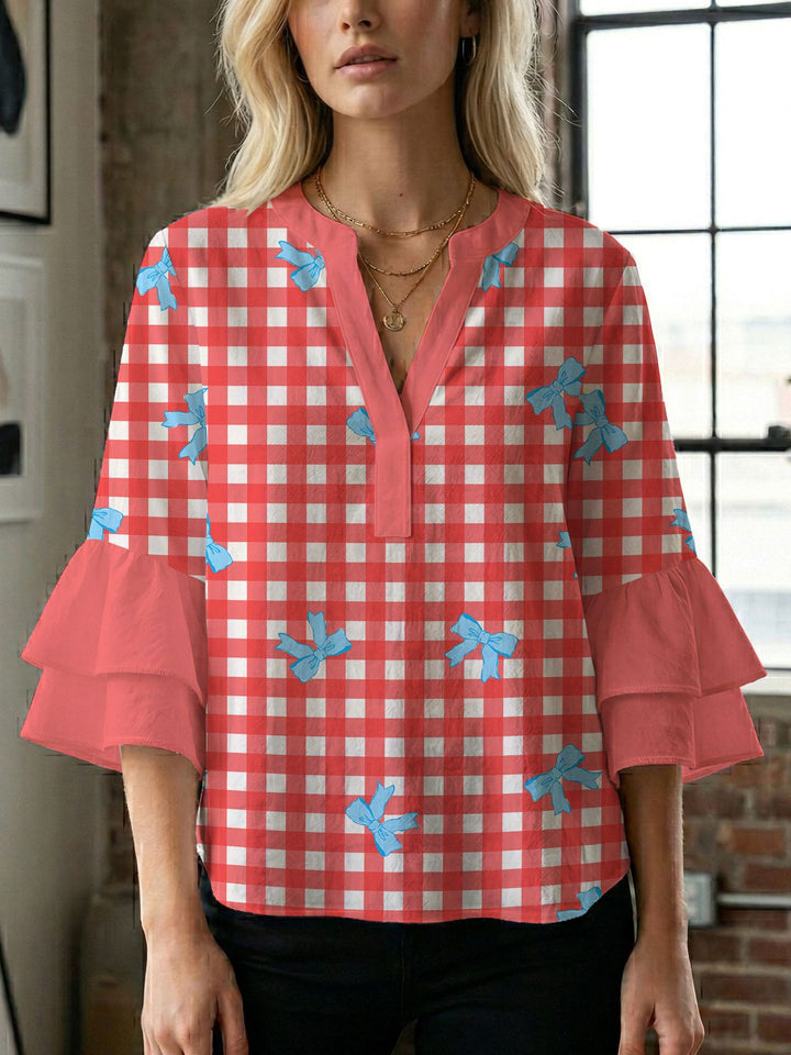 Damern blusenshirt med voluminösa ärmar och kreativt tryckdesign Mirla-Eva Jonsson