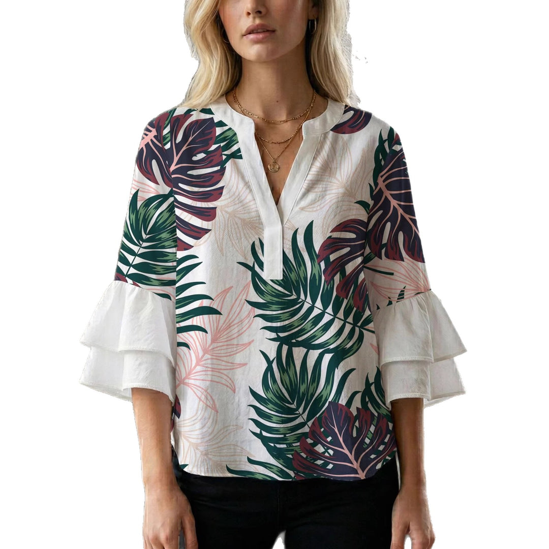 Damern blusenshirt med voluminösa ärmar och kreativt tryckdesign Mirla-Eva Jonsson
