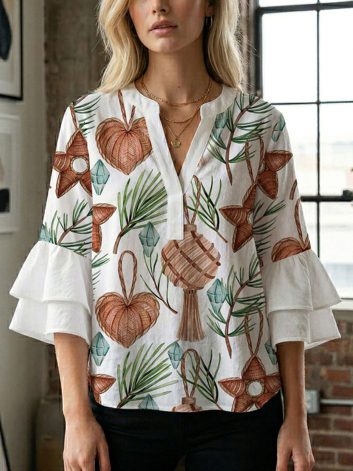 Damern blusenshirt med voluminösa ärmar och kreativt tryckdesign Mirla-Eva Jonsson