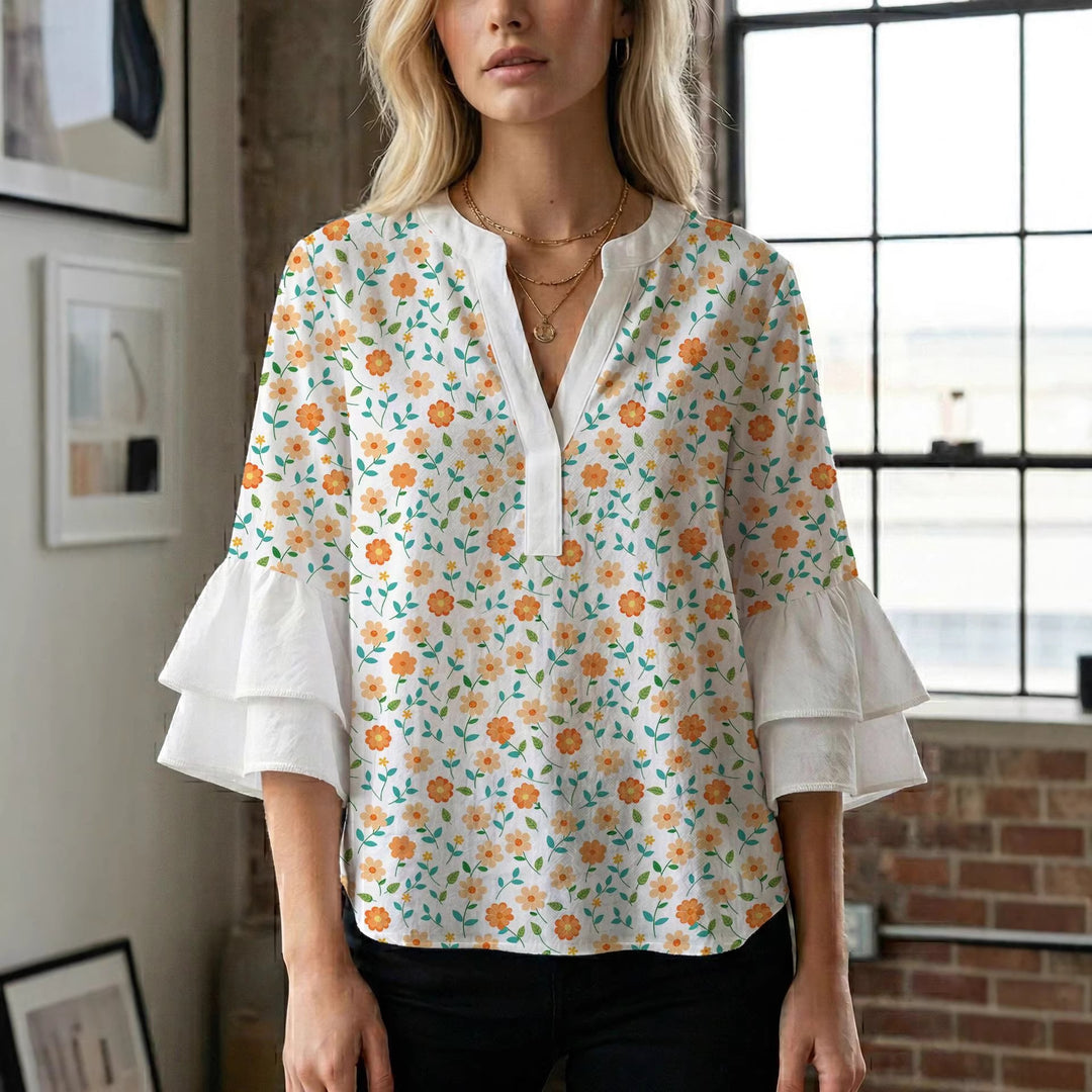 Damern blusenshirt med voluminösa ärmar och kreativt tryckdesign Mirla-Eva Jonsson