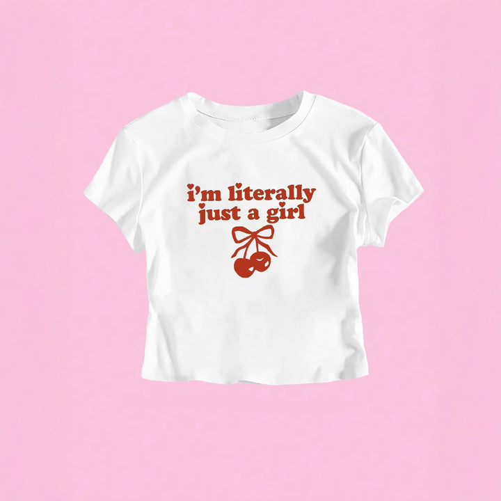 Damern crop-t-shirt med fräckt körsbärsmotiv och lekfullt konstnärligt design Mirla-Eva Jonsson