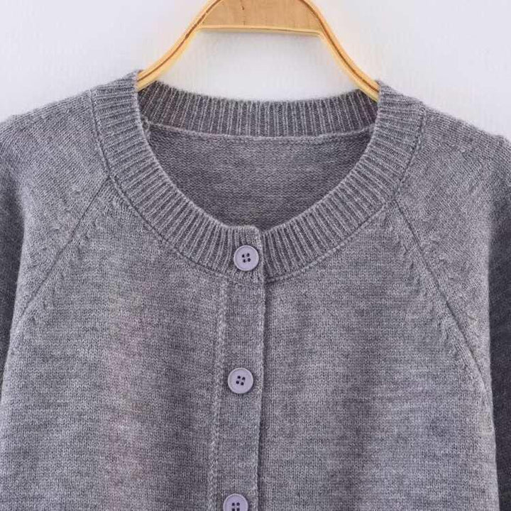 Damern cropped stickad jacka med knappdetaljer och elastisk midja Mirla-Eva Jonsson