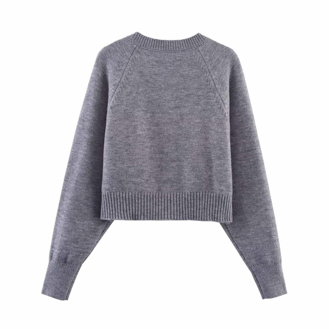 Damern cropped stickad jacka med knappdetaljer och elastisk midja Mirla-Eva Jonsson