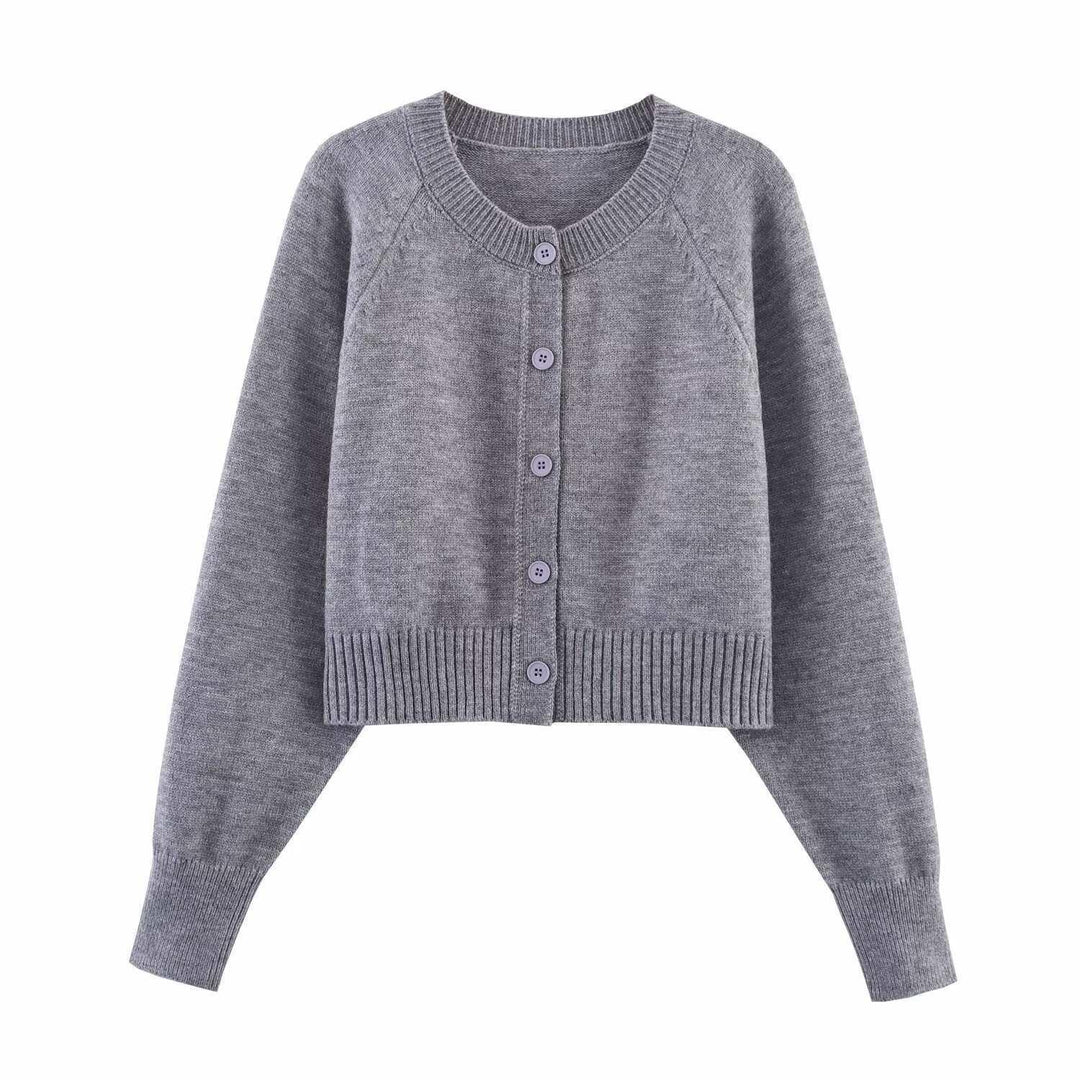 Damern cropped stickad jacka med knappdetaljer och elastisk midja Mirla-Eva Jonsson