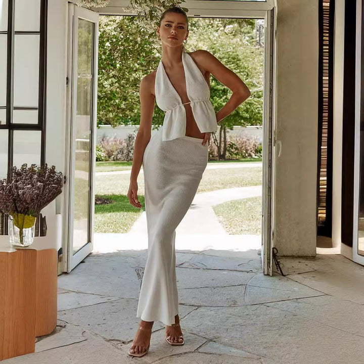 Damern elegant omslagstopp med asymmetrisk design och matchande maxikjol Mirla-Eva Jonsson