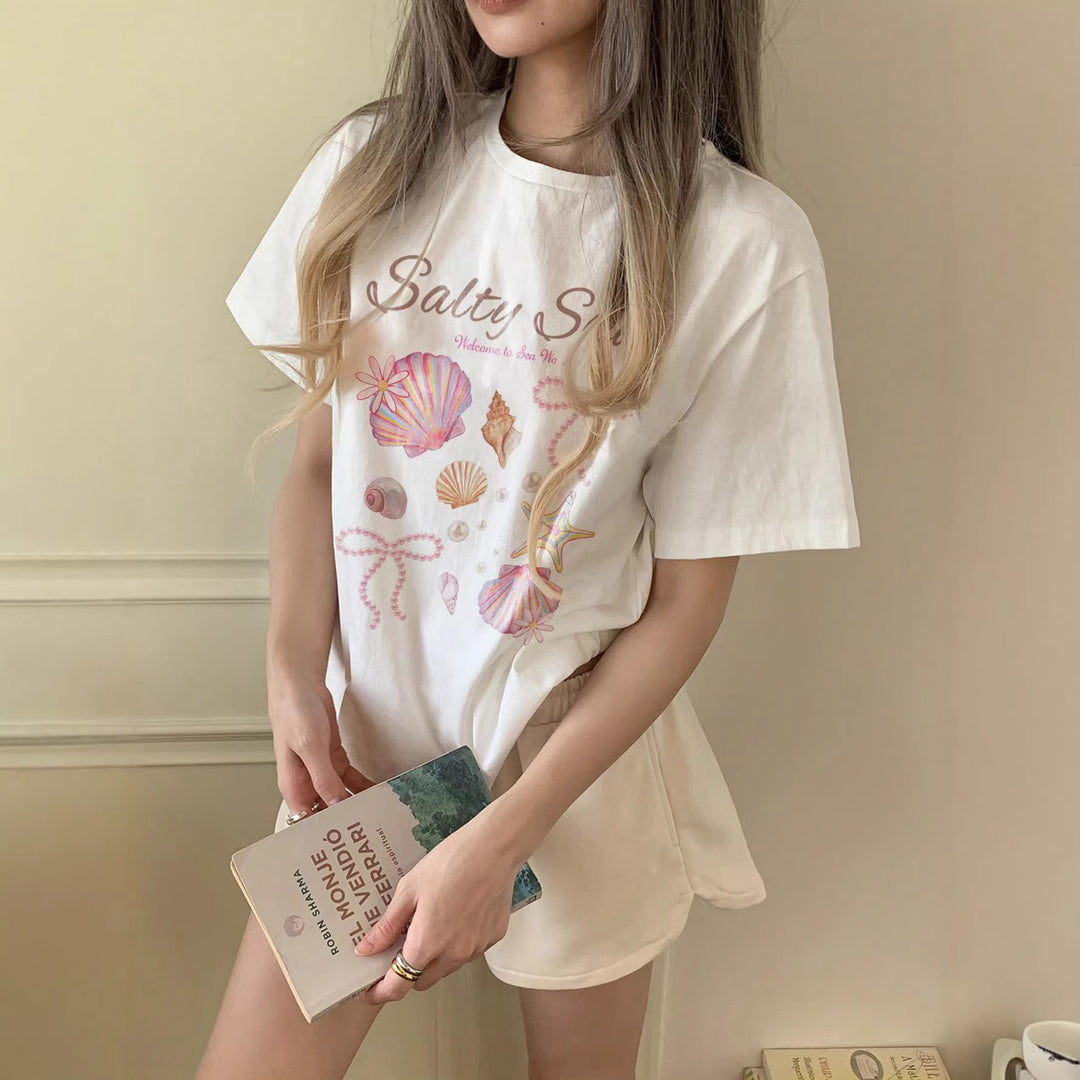 Damern grafik T-shirt med maritimt musselmönster och avslappnad passform Mirla-Eva Jonsson
