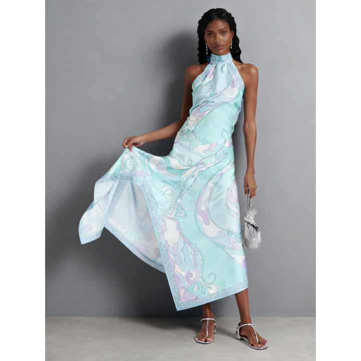 Damern halterklänning med asymmetrisk fåll och iögonfallande grafiskt tryck Mirla-Eva Jonsson