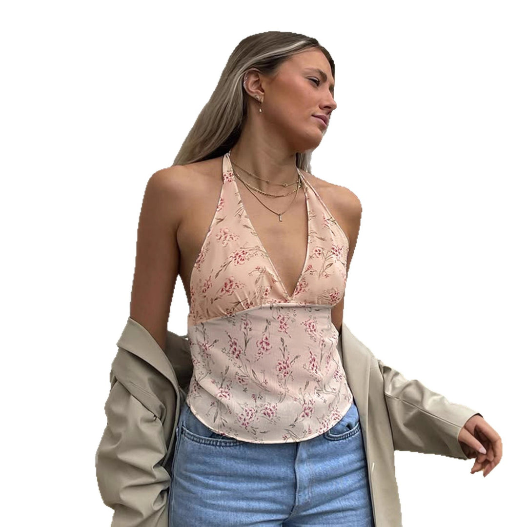 Damern halterneck-top med blommönster och volangdetaljer Mirla-Eva Jonsson