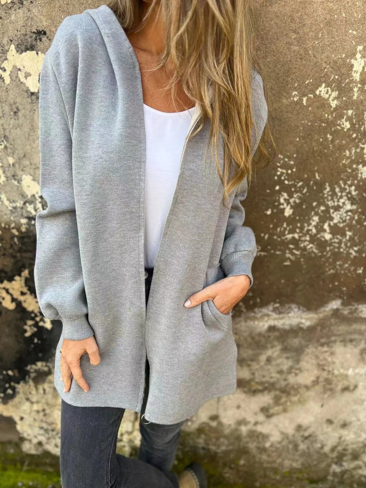 Damern hoodiejacka med långa ärmar och praktisk dragkedja Mirla-Eva Jonsson