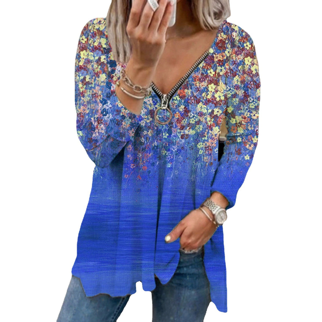 Damern långärmad blus med blommig design och dragkedja Mirla-Eva Jonsson