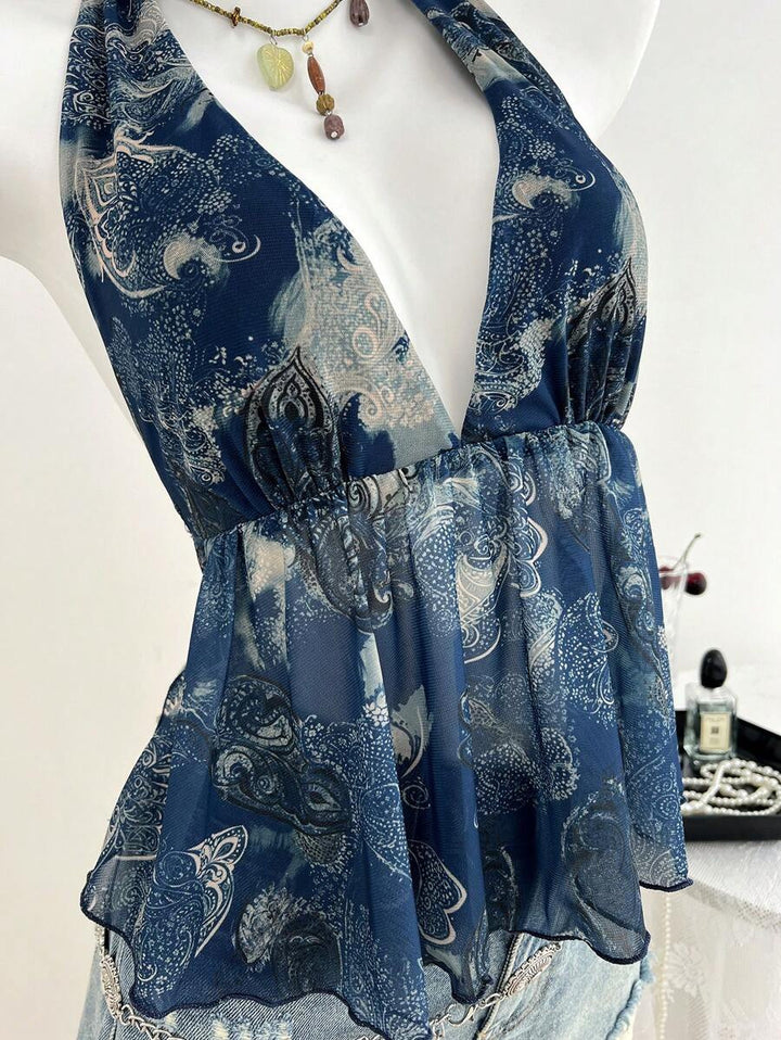 Damern luftig blus-top i halterneck design med blommig tryck Mirla-Eva Jonsson