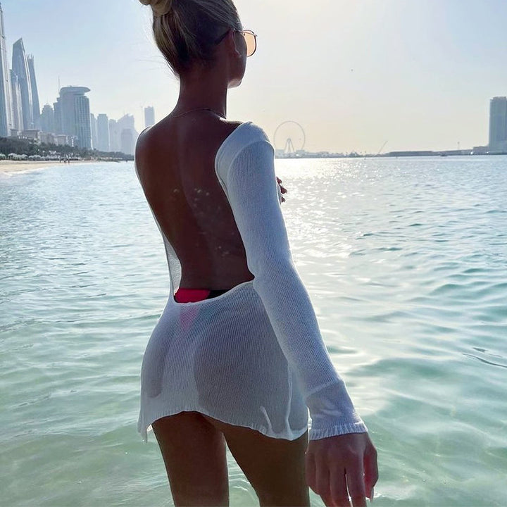 Damern luftig stickad strandklänning med transparent design och långa ärmar Mirla-Eva Jonsson