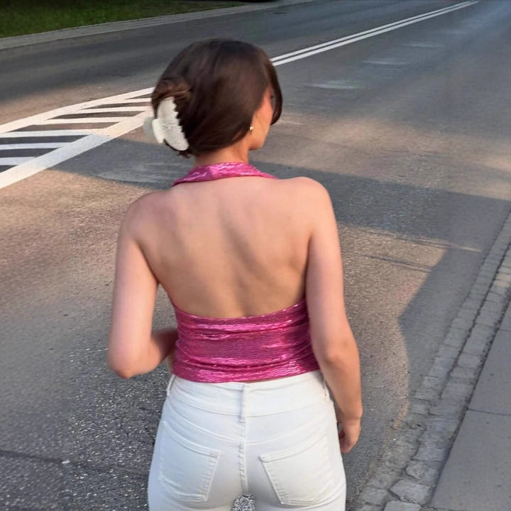 Damern rygglös topp med djup V-hals och raffinerade volangdetaljer Mirla-Eva Jonsson