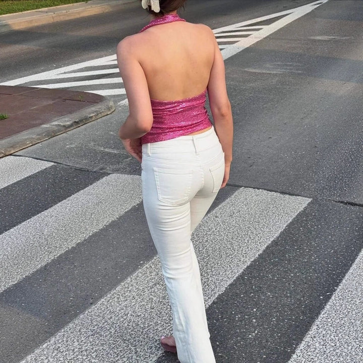 Damern rygglös topp med djup V-hals och raffinerade volangdetaljer Mirla-Eva Jonsson