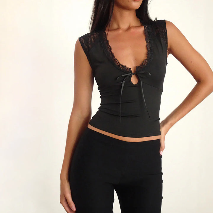 Damern spets-bustier med dekorativa rosett-detaljer Mirla-Eva Jonsson