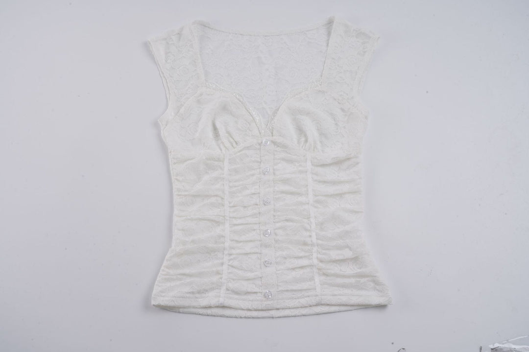 Damern spets-crop-top med elegant V-ringning och volangdetaljer Mirla-Eva Jonsson