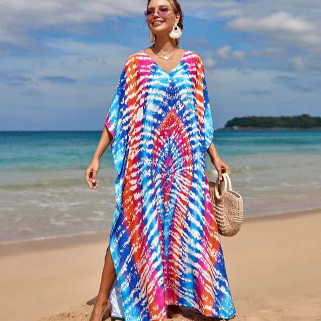 Damern strandklänning med färgglad batikdesign och vida ärmar Mirla-Eva Jonsson