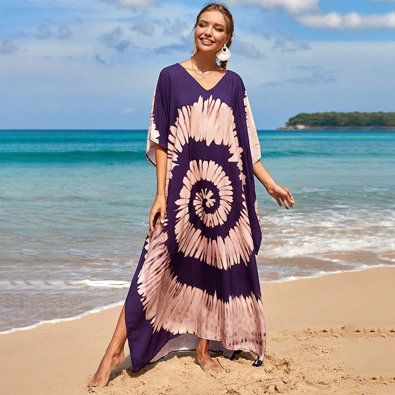Damern strandklänning med färgglad batikdesign och vida ärmar Mirla-Eva Jonsson