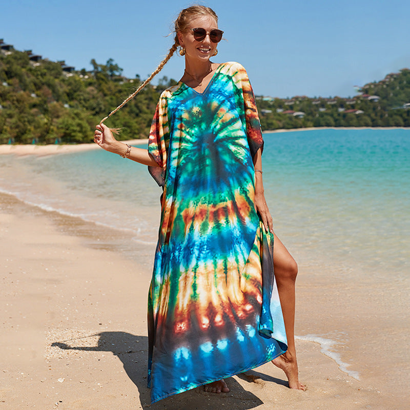 Damern strandklänning med färgglad batikdesign och vida ärmar Mirla-Eva Jonsson
