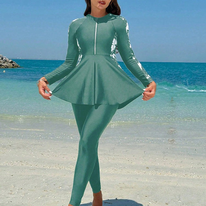 Damern surfdräkt med elegant A-linje och långa ärmar Mirla-Eva Jonsson