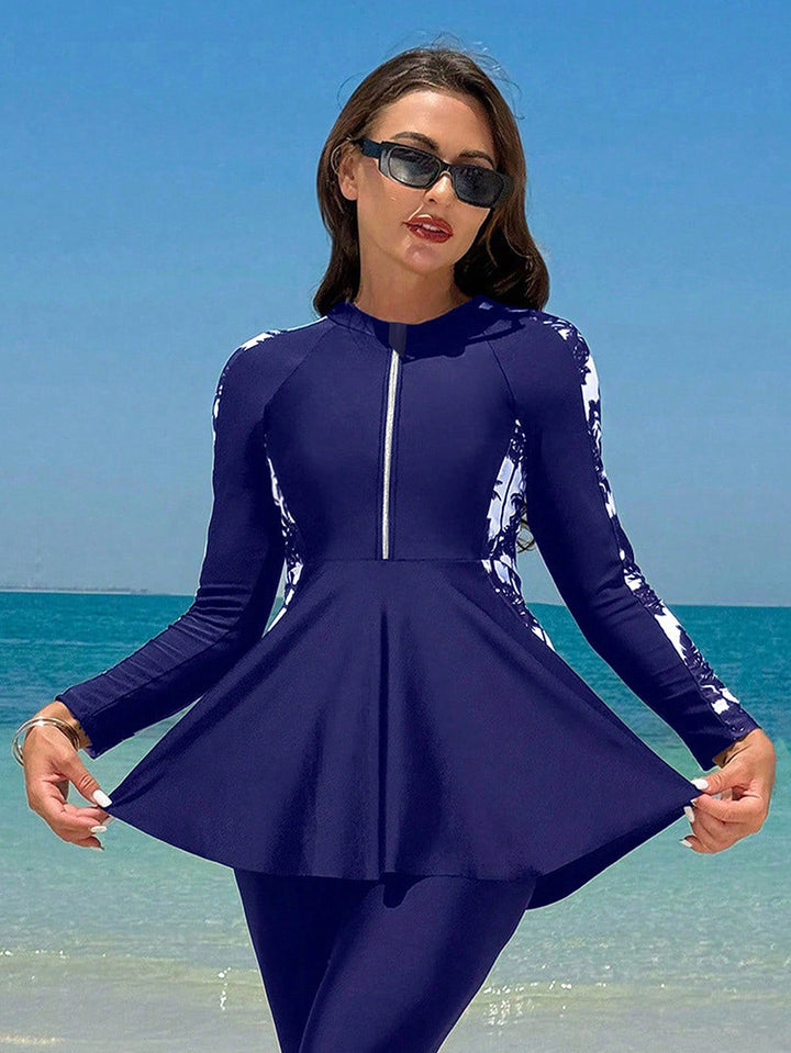 Damern surfdräkt med elegant A-linje och långa ärmar Mirla-Eva Jonsson