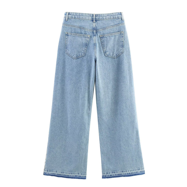 Damern vida jeans med blommiga spetsapplikationer Mirla-Eva Jonsson