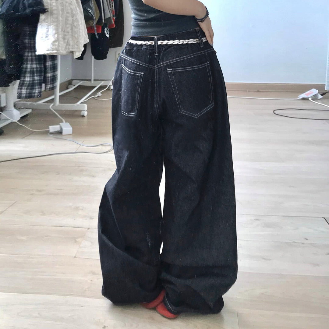 Damern vidare jeans med eleganta konstverk Mirla-Eva Jonsson