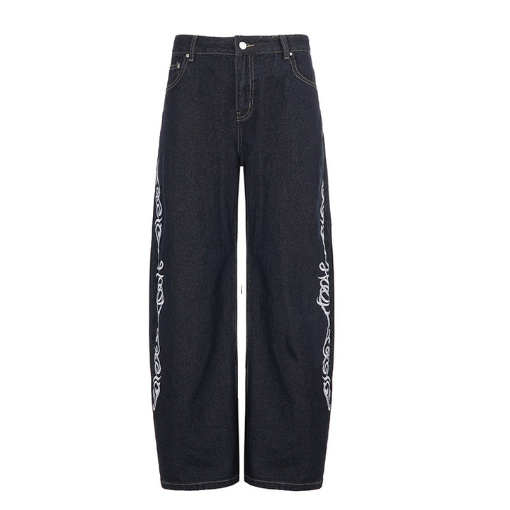 Damern vidare jeans med eleganta konstverk Mirla-Eva Jonsson