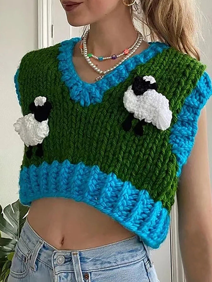 Damern virkade crop-top med kreativa fårmotiv Mirla-Eva Jonsson
