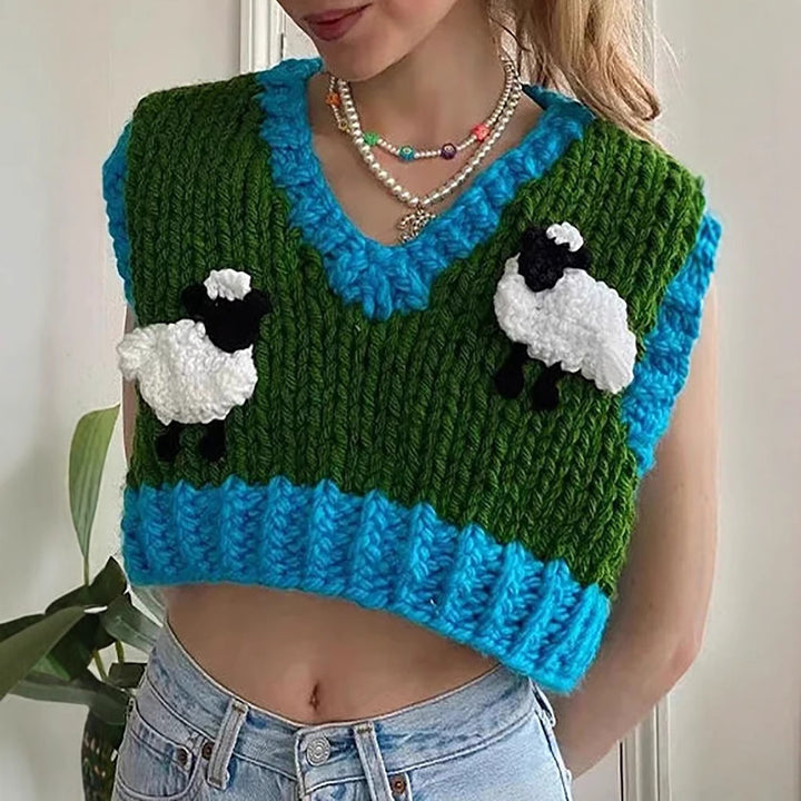 Damern virkade crop-top med kreativa fårmotiv Mirla-Eva Jonsson