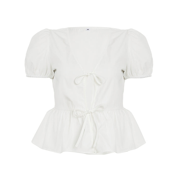 Damern wrap-top med puffärmar och feminin peplum-skjortkant Mirla-Eva Jonsson