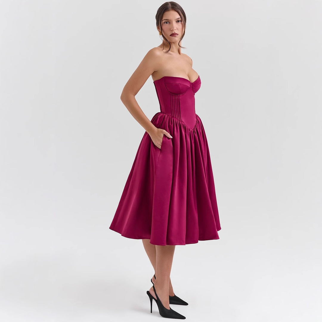 Damerna couture-klänning i en off-the-shoulder bärremdesign med en voluminös kjol Mirla-Eva Jonsson