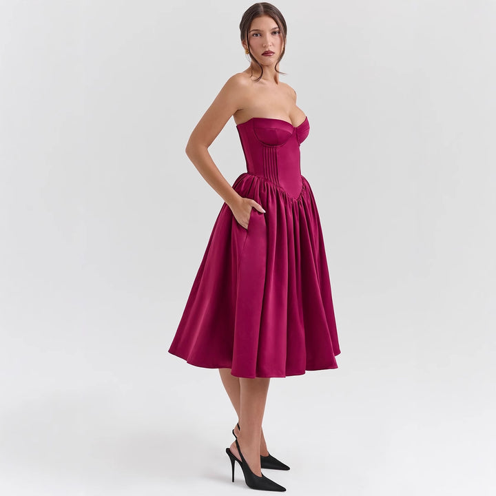 Damerna couture-klänning i en off-the-shoulder bärremdesign med en voluminös kjol Mirla-Eva Jonsson