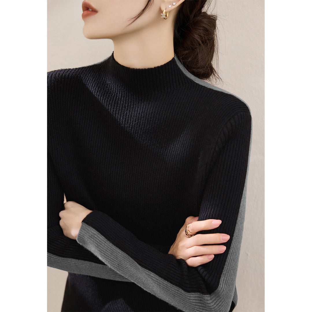 Damerna fashionabla polotröja med texturerad ribbdesign och kontrasterande ärmar Mirla-Eva Jonsson