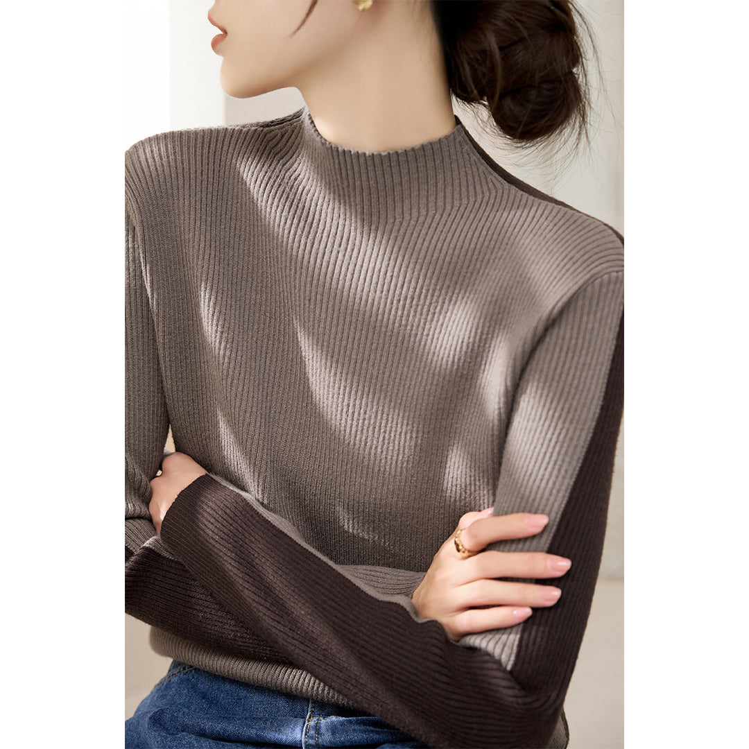 Damerna fashionabla polotröja med texturerad ribbdesign och kontrasterande ärmar Mirla-Eva Jonsson