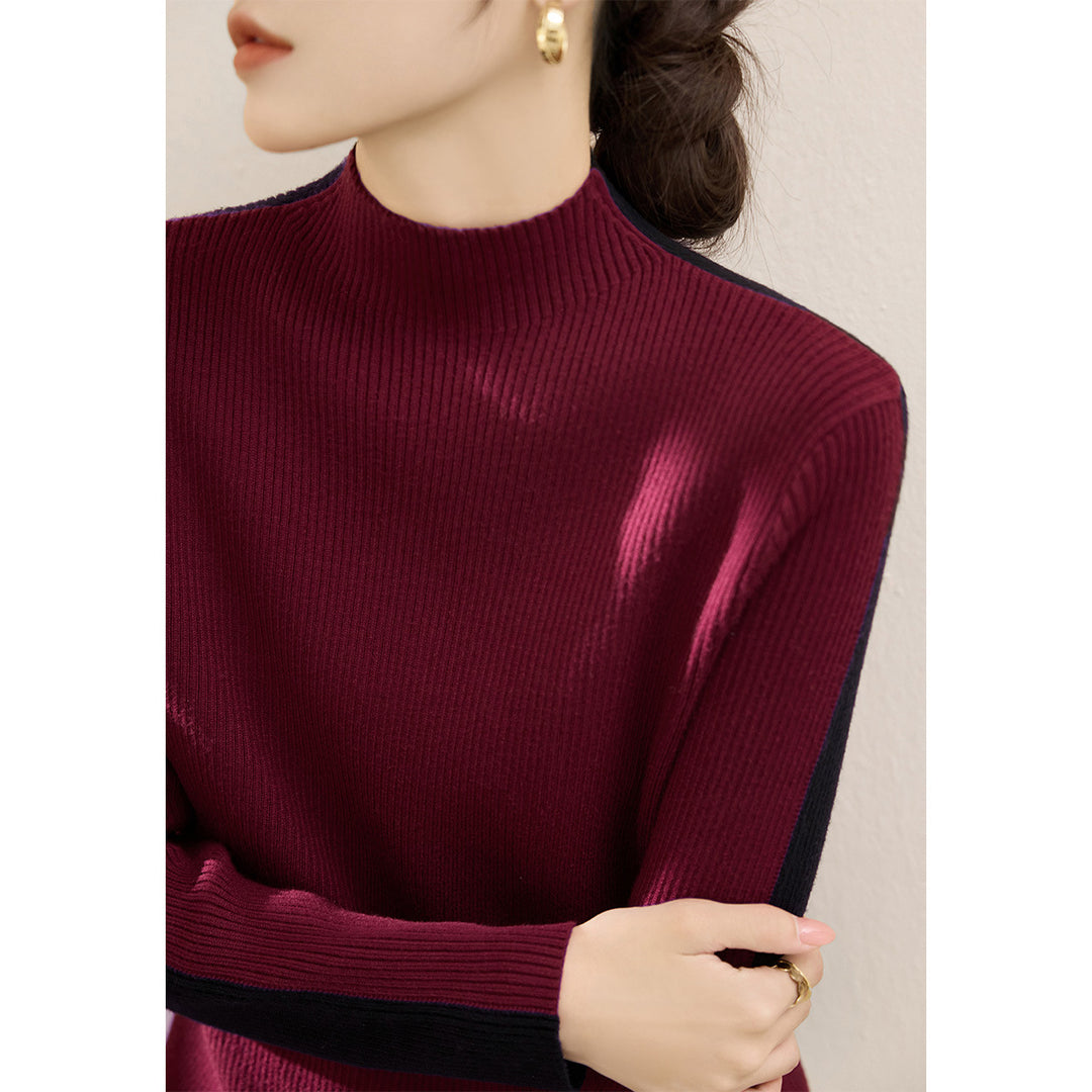 Damerna fashionabla polotröja med texturerad ribbdesign och kontrasterande ärmar Mirla-Eva Jonsson
