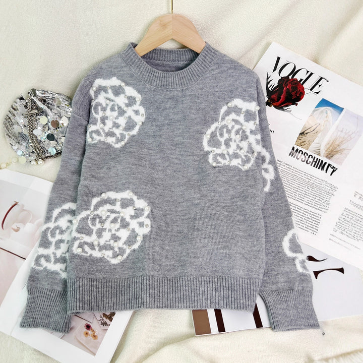 Damerna fashionable pullover med detaljerade blommor appliker och pärl dekorationer Mirla-Eva Jonsson